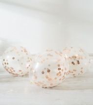 Rose gold balloon filling confetti